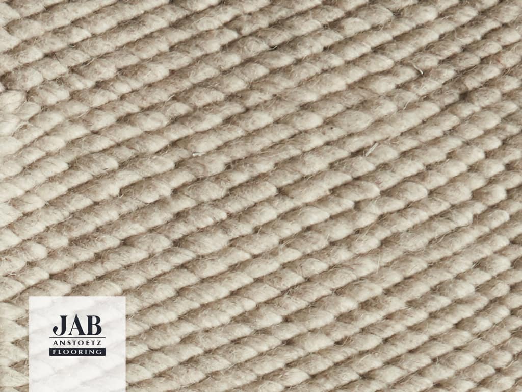 Beigefarbiger Teppich geflochten, Detailbild