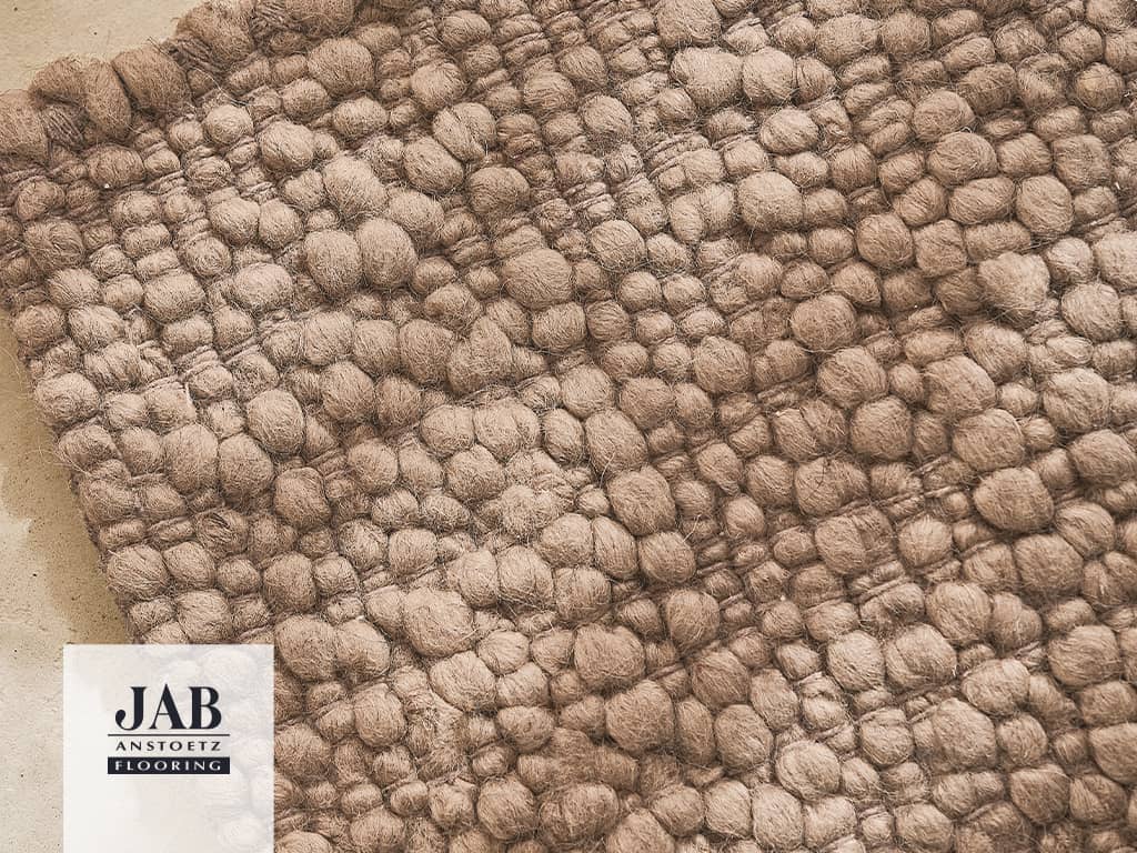 Beigefarbiger Teppich Detailbild
